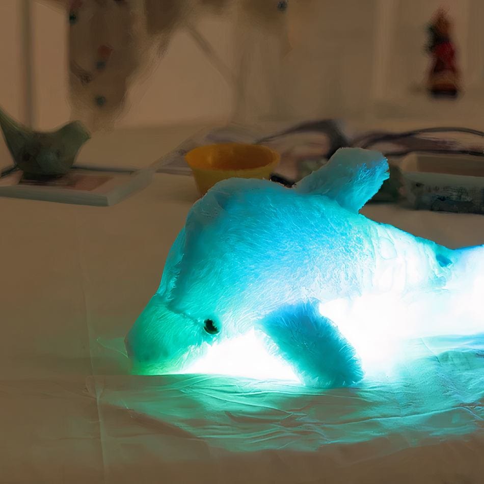 La Peluche Bleu Peluche dauphin lumineux