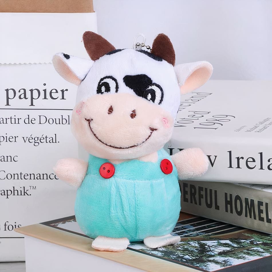 La Peluche Bleu Peluche vache porte-clés