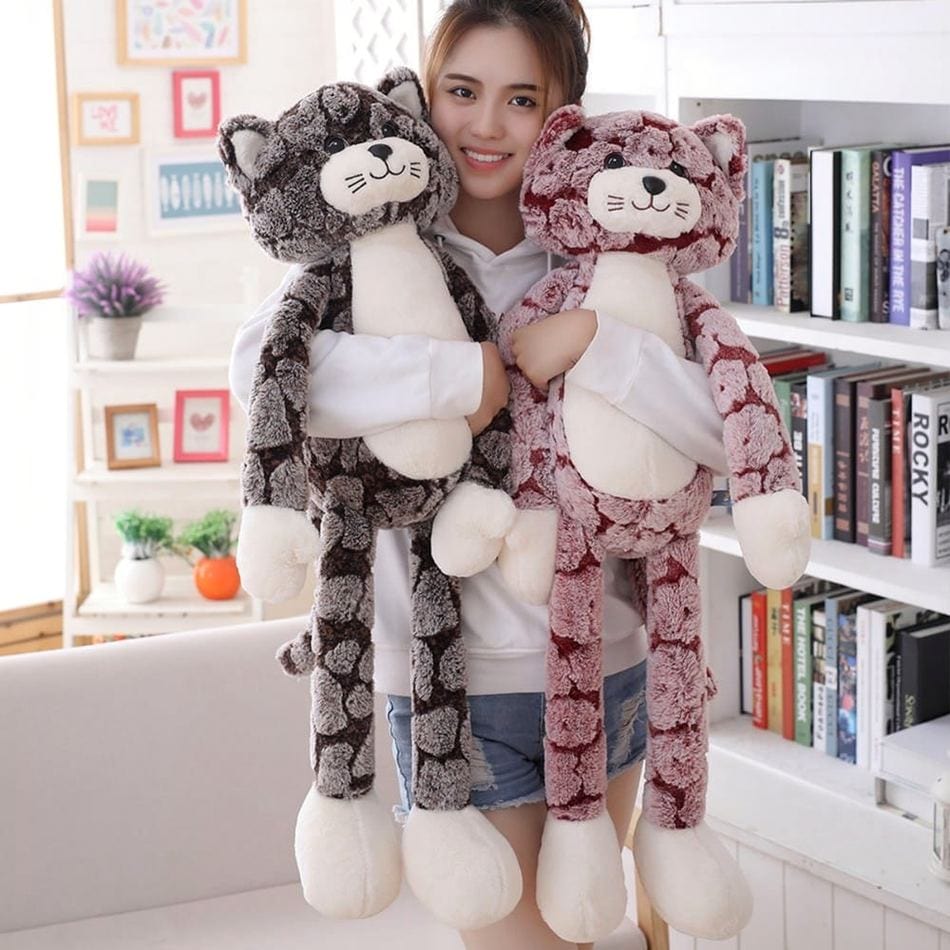 La Peluche Peluche chat rose aux longues jambes