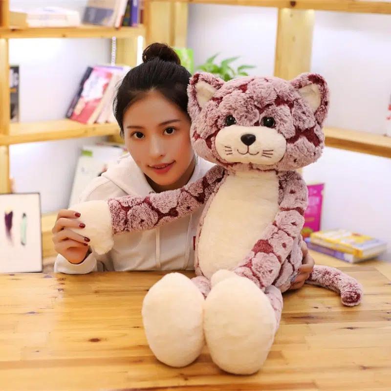 La Peluche Peluche chat rose aux longues jambes