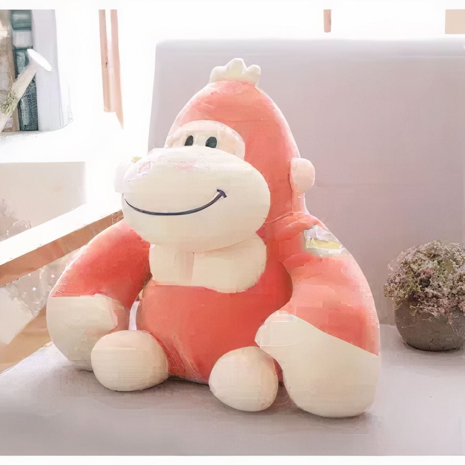 La Peluche Peluche gorille orange heureux