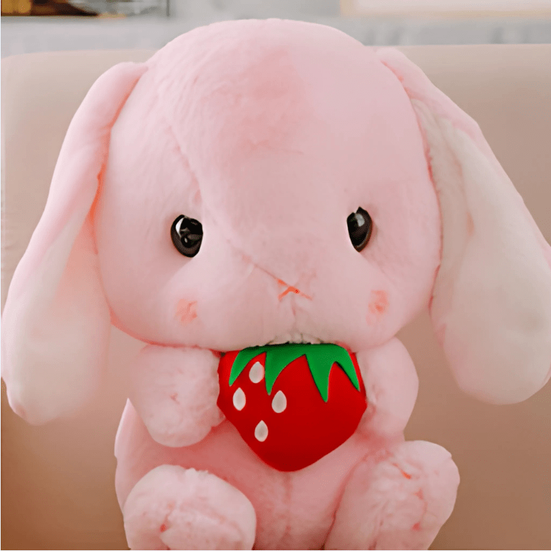 La Peluche Peluche lapin avec une fraise