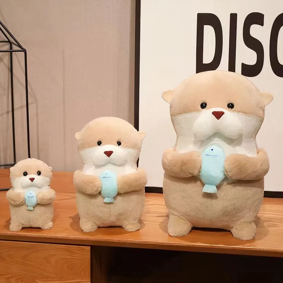 La Peluche Peluche loutre et son poisson