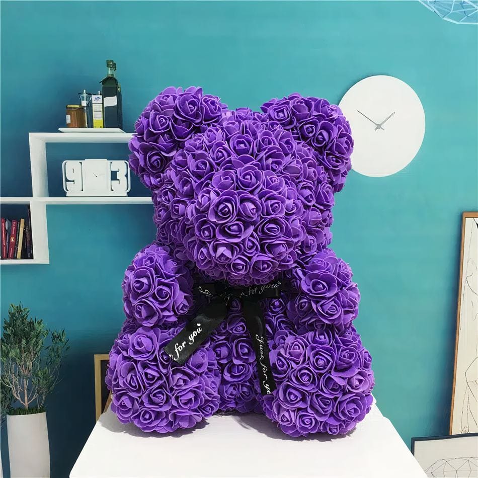 La Peluche Peluche ours avec fleur violette
