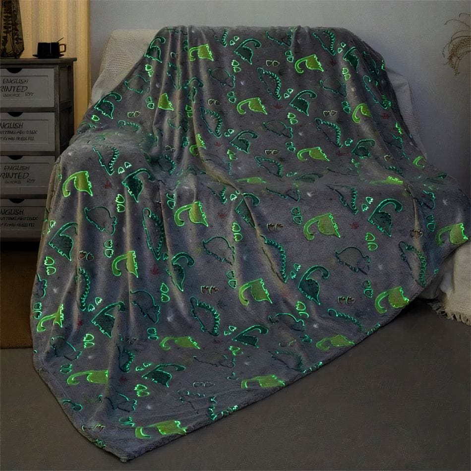 La Peluche Plaid lumineux motif dinosaure