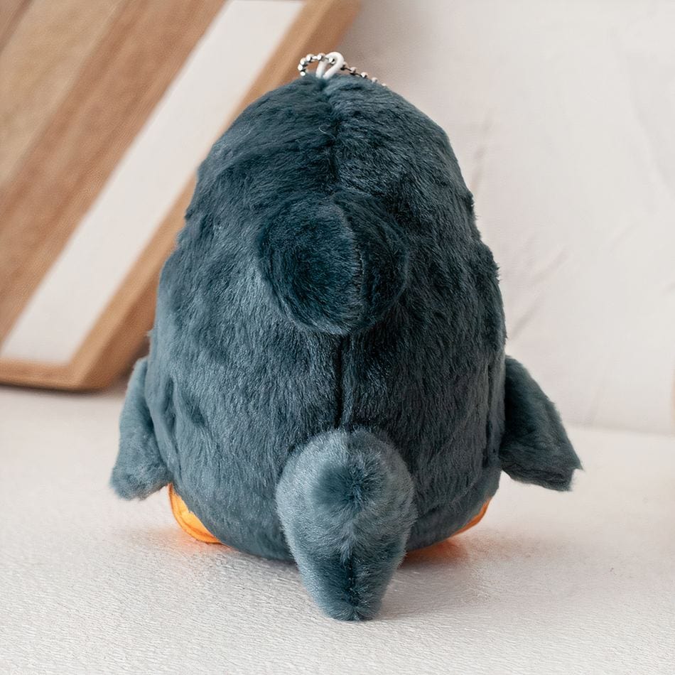 La Peluche Poupée en peluche petit chat déguisé en requin