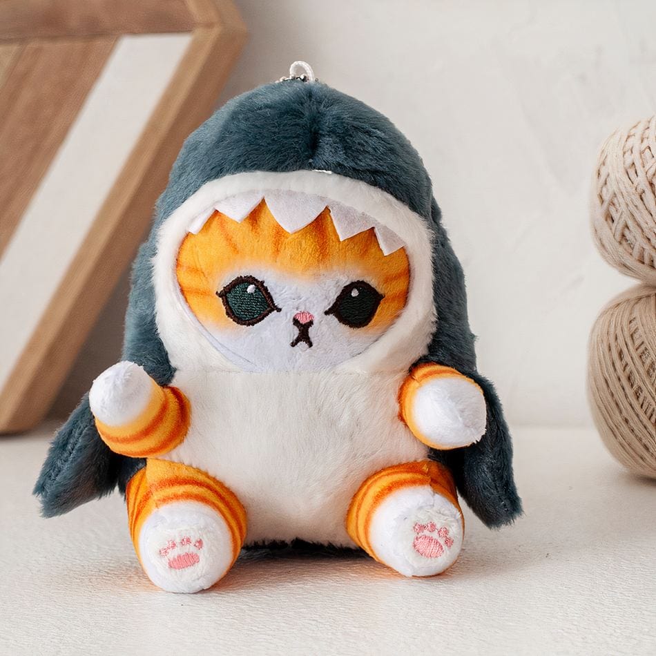 La Peluche Poupée en peluche petit chat déguisé en requin