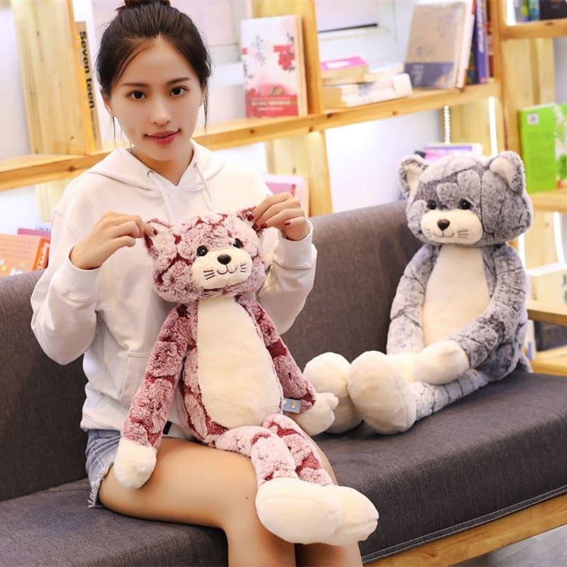 La Peluche Peluche chat gris aux longues jambes