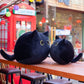 La Peluche Peluche chaton noir aux grands yeux