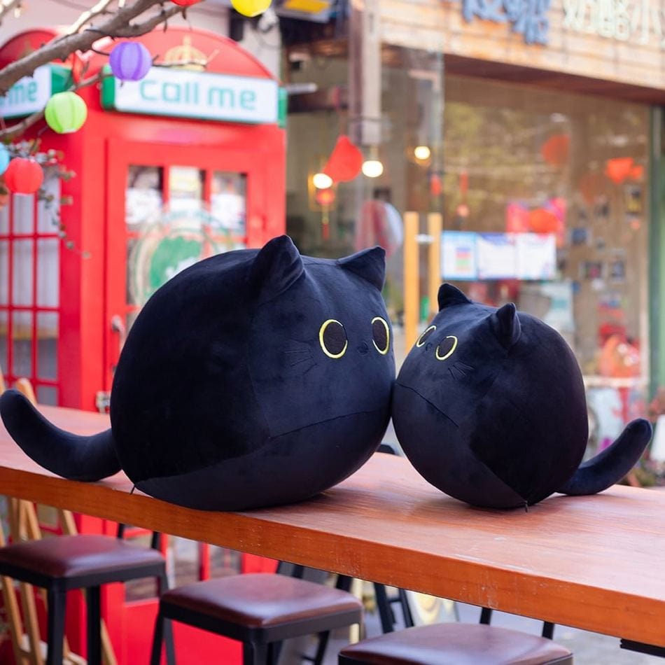 La Peluche Peluche chaton noir aux grands yeux