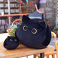 La Peluche Peluche chaton noir aux grands yeux