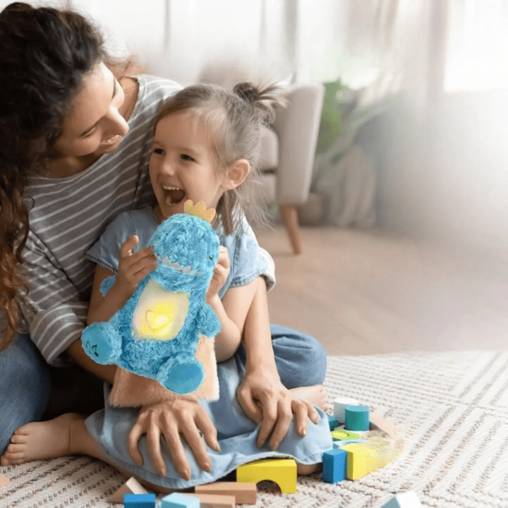 La Peluche Peluche dinosaure adorable respirante avec berceuse