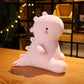 La Peluche Peluche dinosaure adorable rose