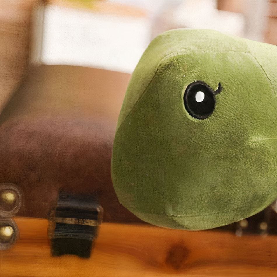 La Peluche Peluche dinosaure vert