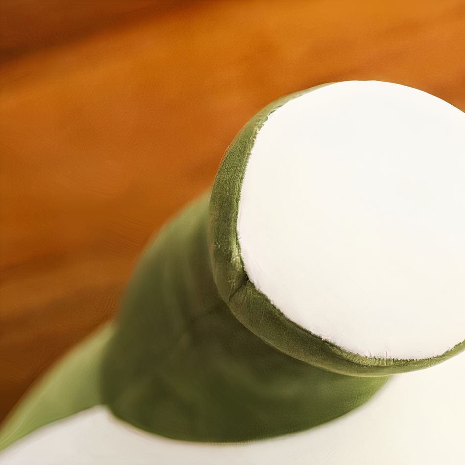 La Peluche Peluche dinosaure vert