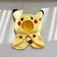 La Peluche Peluche Evoli déguisée en Pikachu jaune