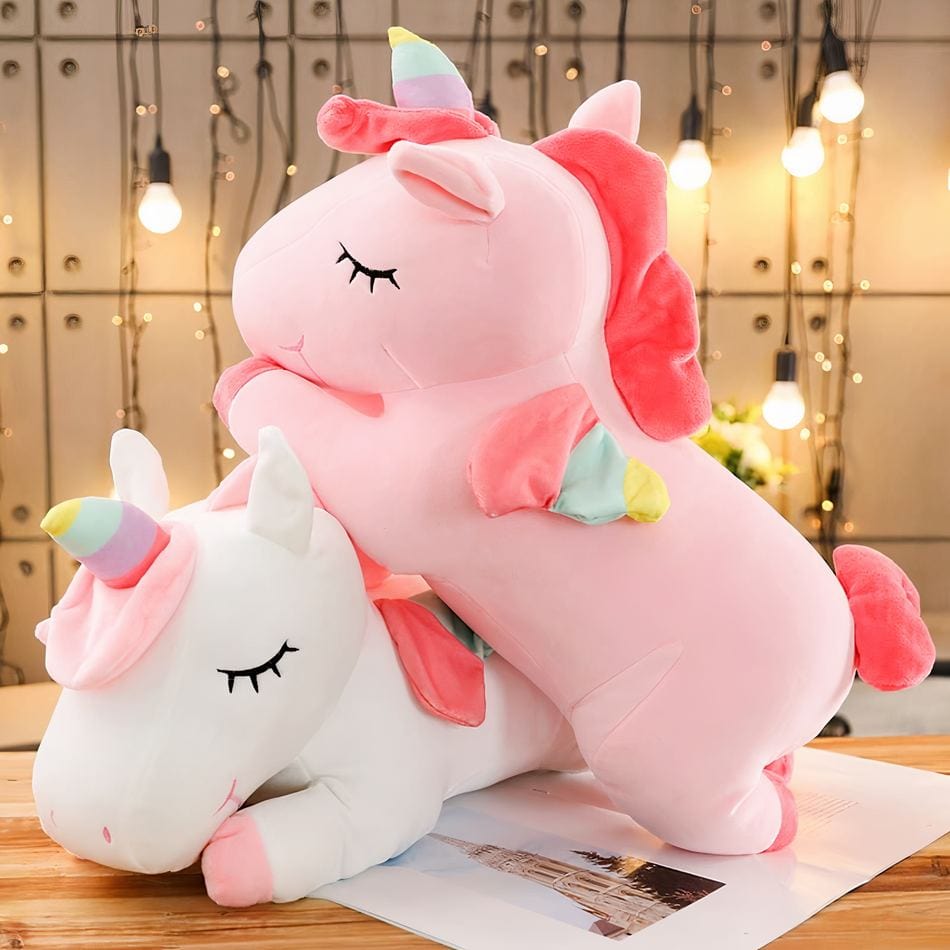 La Peluche Peluche licorne blanche couchée