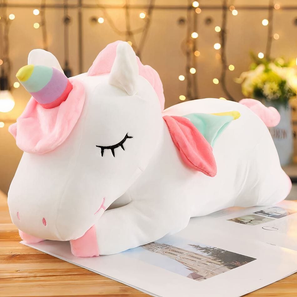 La Peluche Peluche licorne blanche couchée