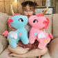 La Peluche Peluche licorne rose avec corne dorée