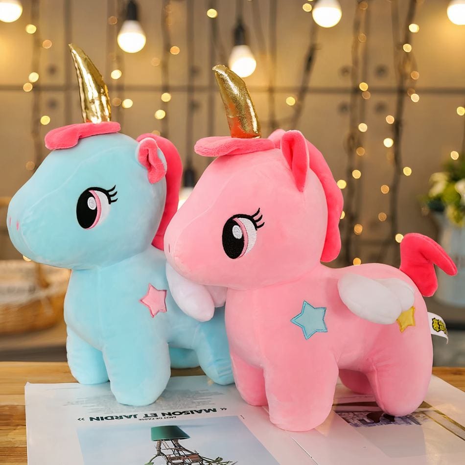La Peluche Peluche licorne rose avec corne dorée