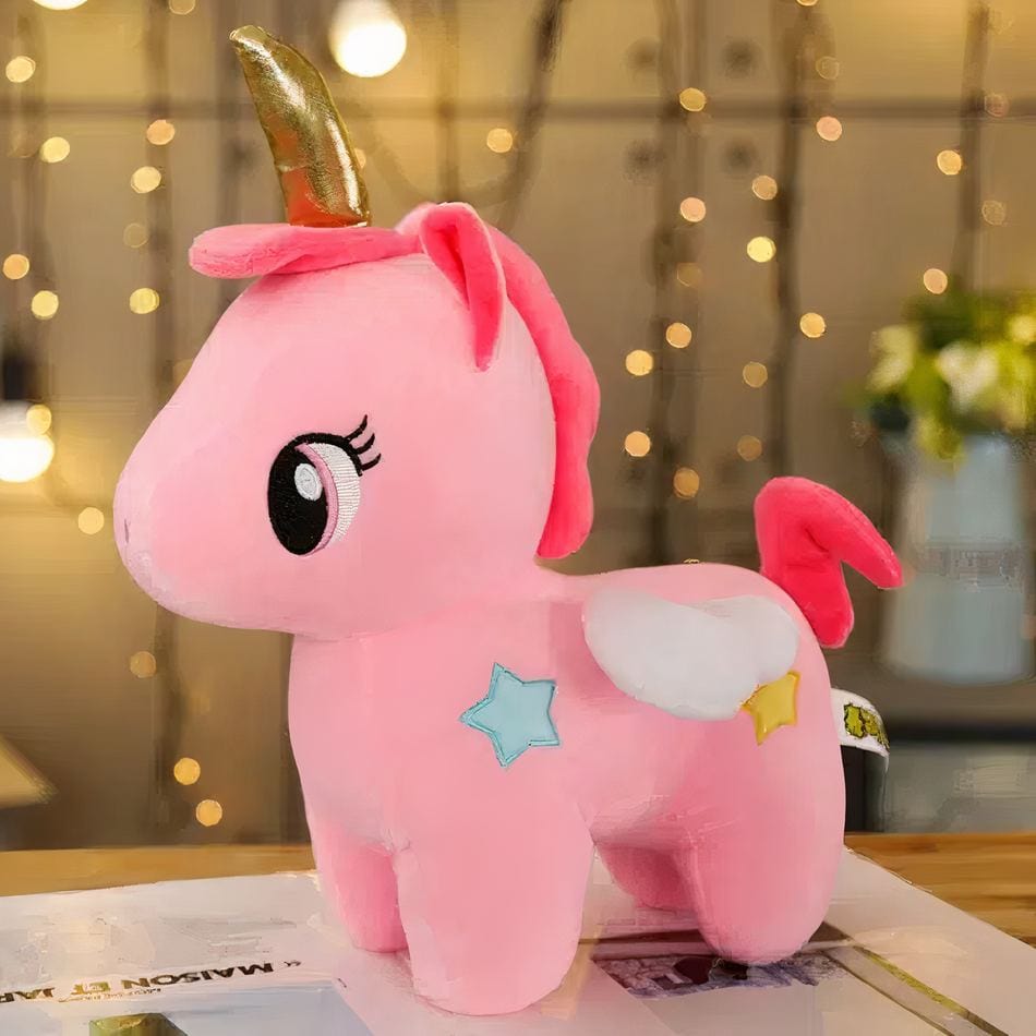 La Peluche Peluche licorne rose avec corne dorée