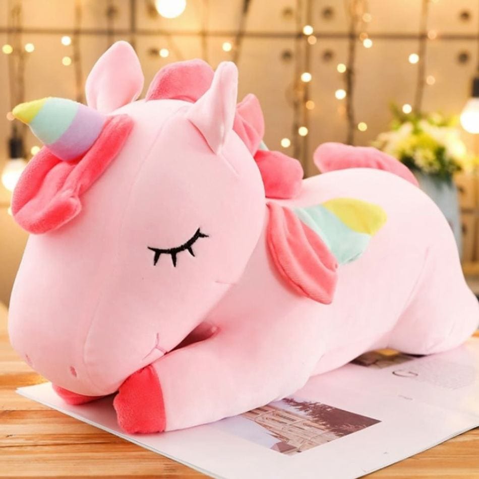 La Peluche Peluche licorne rose couchée