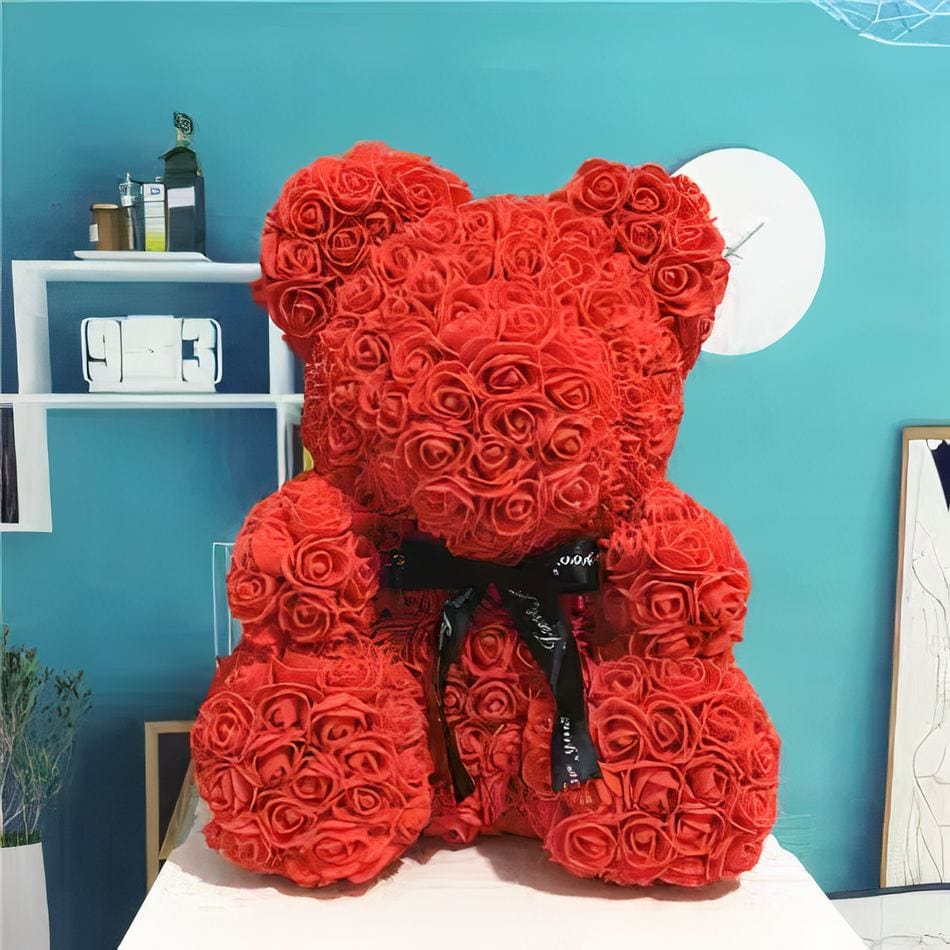 La Peluche Peluche ours avec fleur rouge