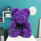 La Peluche Peluche ours avec fleur violette