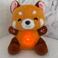 La Peluche Peluche panda roux respirante avec berceuse