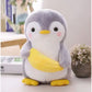 La Peluche Peluche pingouin avec une banane