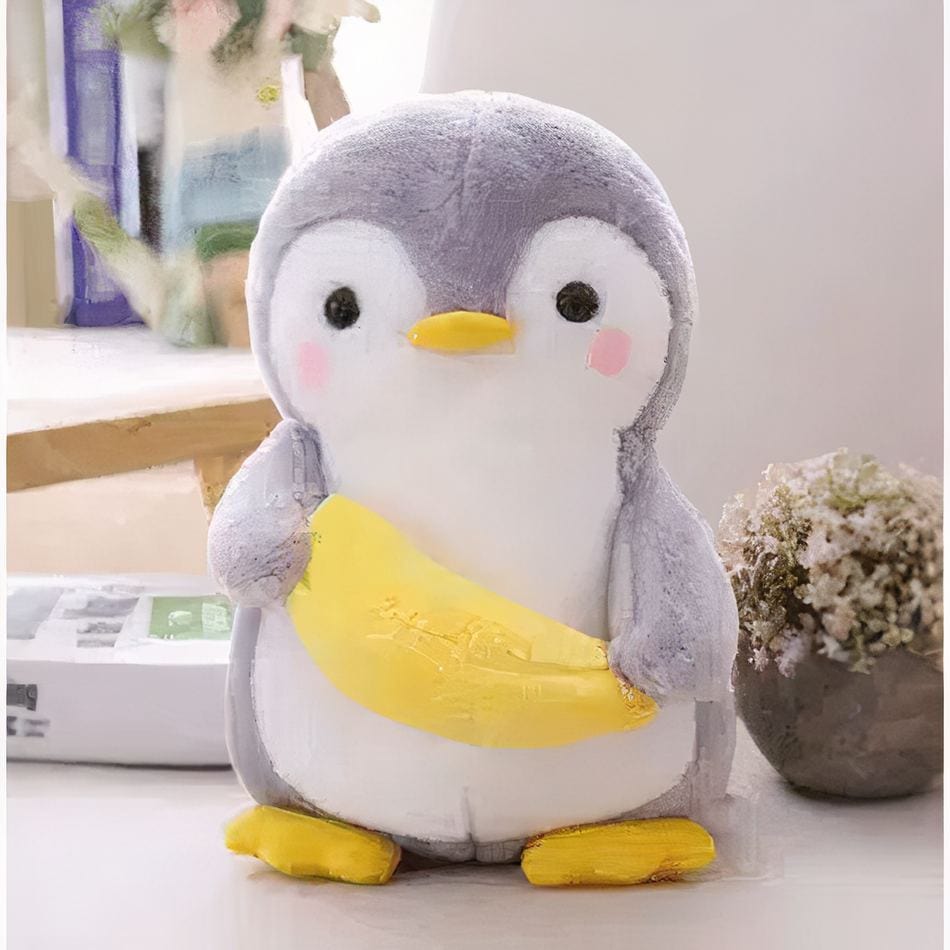 La Peluche Peluche pingouin avec une banane