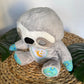 La Peluche Peluche veilleuse paresseux respirante