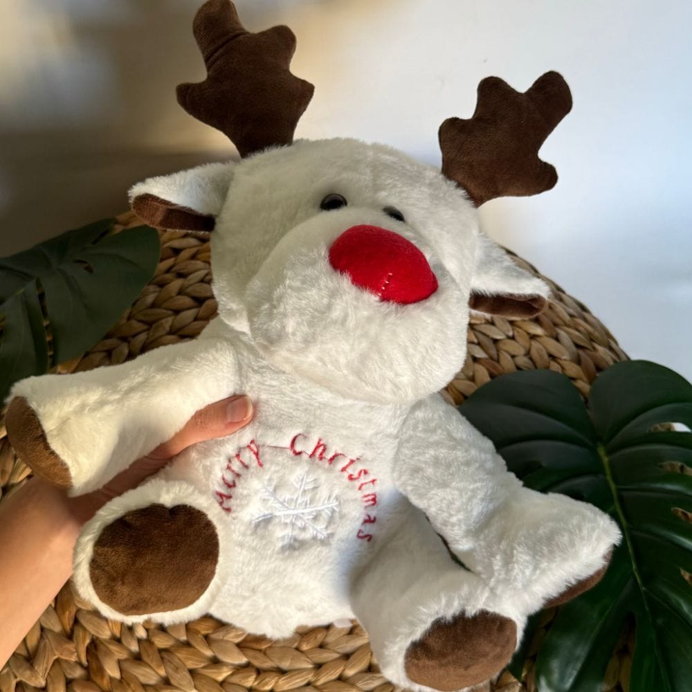 La Peluche Peluche veilleuse renne de Noël respirante avec berceuses