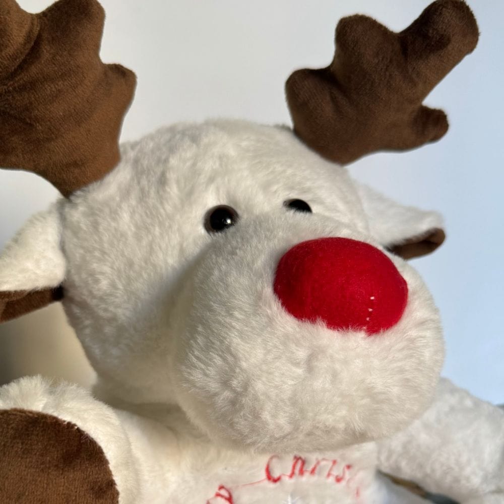 La Peluche Peluche veilleuse renne de Noël respirante avec berceuses