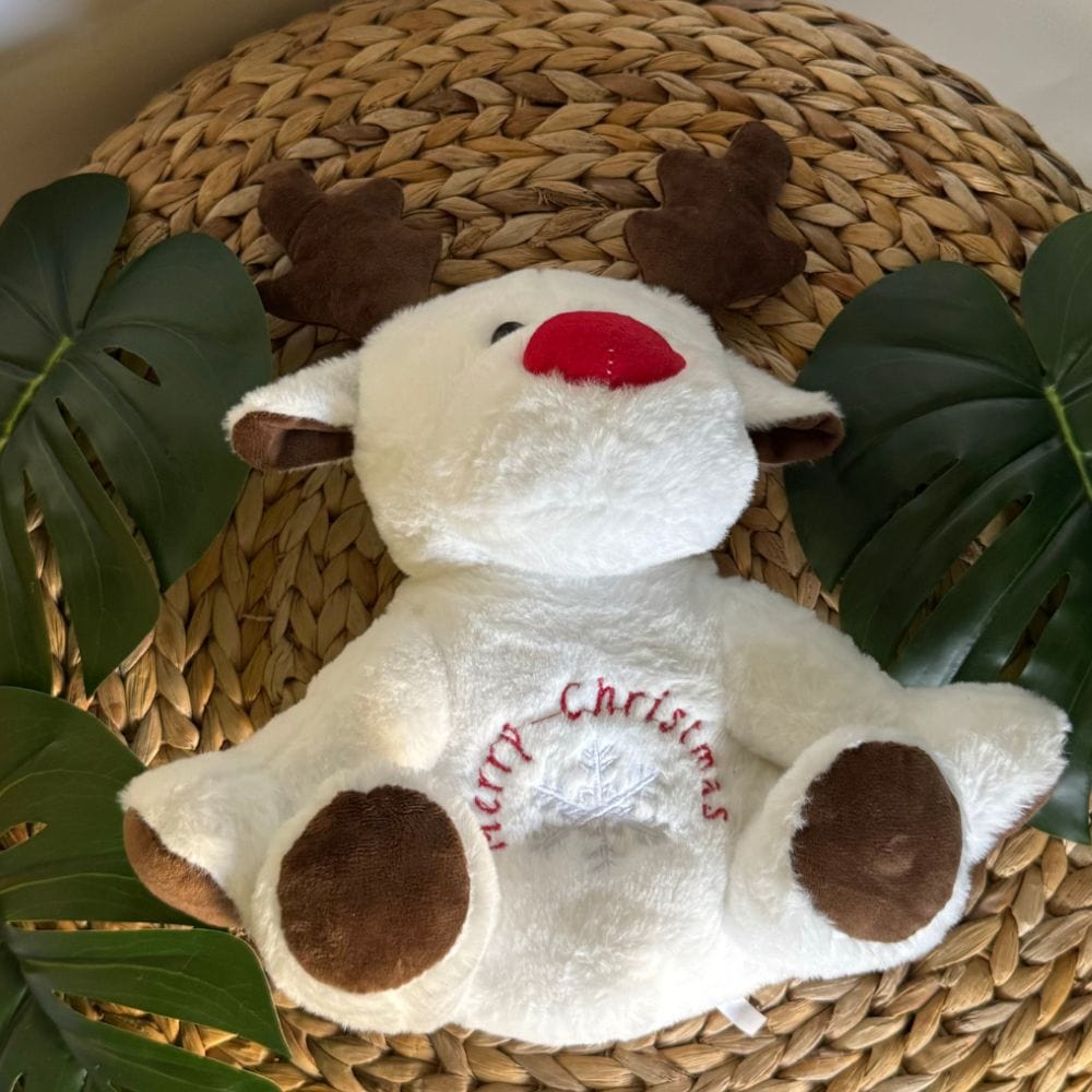 La Peluche Peluche veilleuse renne de Noël respirante avec berceuses