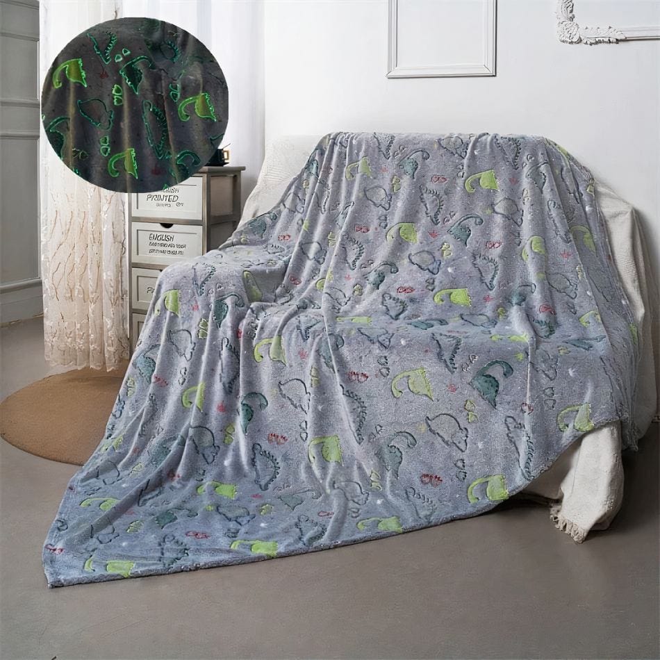La Peluche Plaid lumineux motif dinosaure