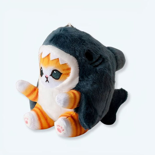 La Peluche Poupée en peluche petit chat déguisé en requin